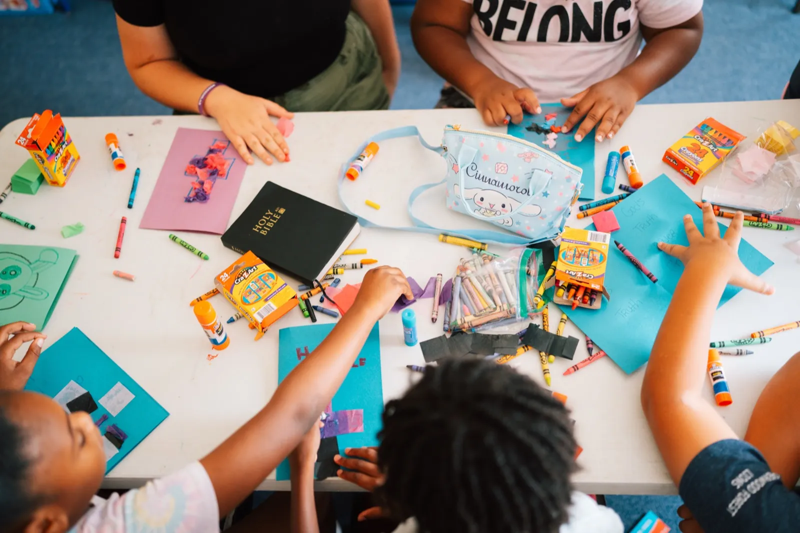 Students doing a Bible craft activity
