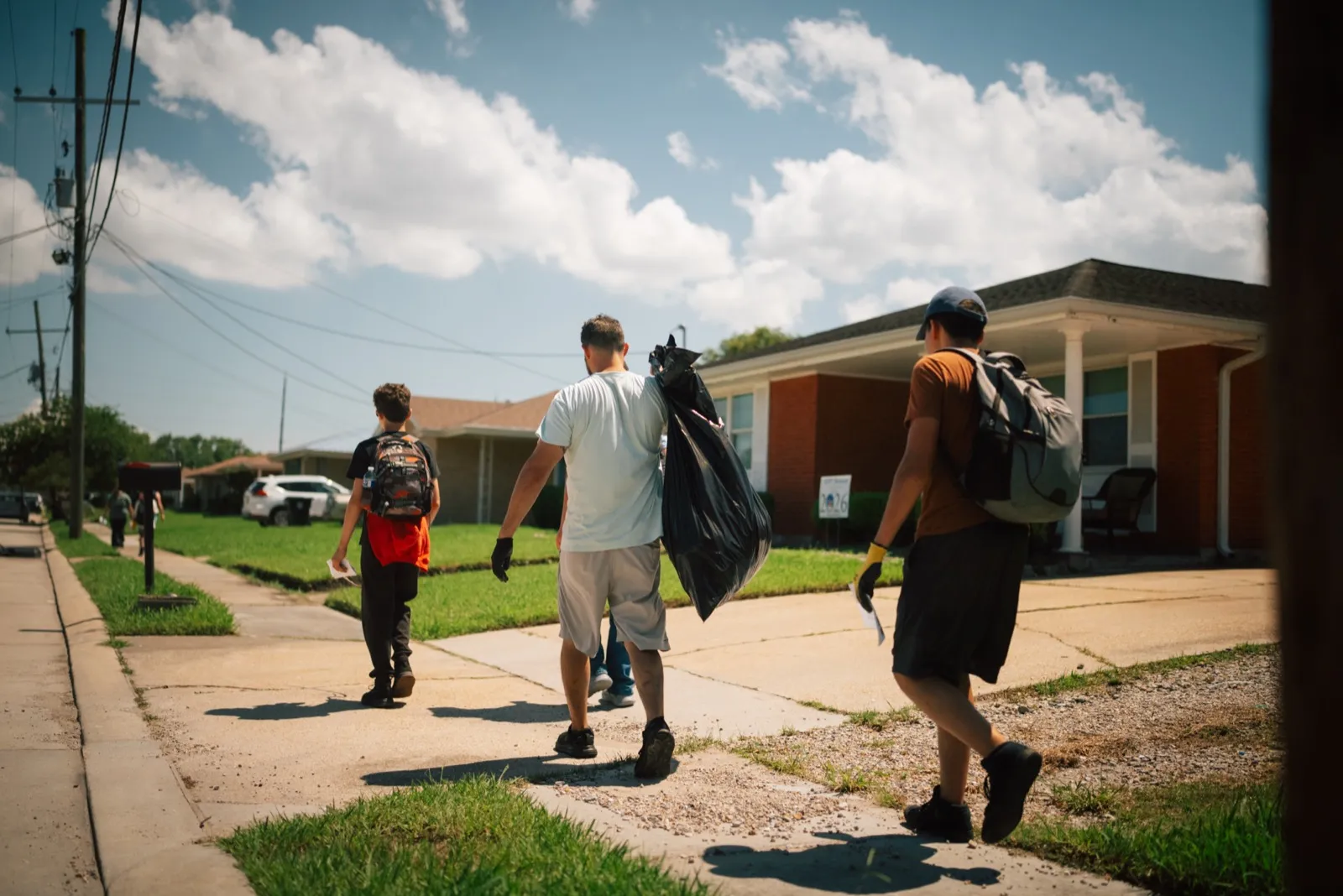 Adult team doing neighborhood cleanup
