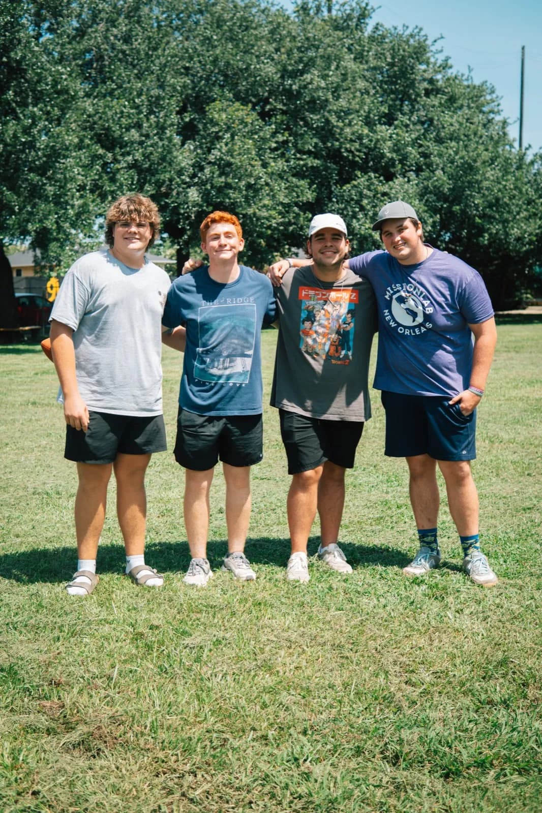 Family group photo on the grass field